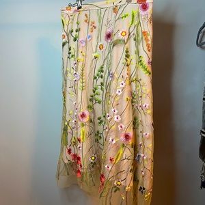 Embroidered on mesh midi skirt.